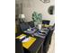 Dining room showcasing a table setting with yellow and blue accents, and seating for six at 8141 Roseville Rd, Davenport, FL 33896