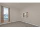 Bedroom with window, neutral carpet, and built in mirror on the wall at 908 Saza Run, Casselberry, FL 32707