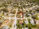 Wide aerial view of a house surrounded by lush greenery in a suburban neighborhood, highlighted in red at 600 Park Valley Cir, Minneola, FL 34715