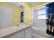 Full bathroom with a single sink vanity, toilet, and bath tub with shower at 600 Park Valley Cir, Minneola, FL 34715