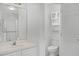 Bright bathroom with a shower enclosure, vanity, and toilet closet at 600 Park Valley Cir, Minneola, FL 34715