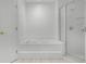 Bathroom features a large soaking tub with a glass enclosed shower at 600 Park Valley Cir, Minneola, FL 34715