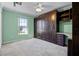 Bedroom with a large window and built in storage cabinets at 600 Park Valley Cir, Minneola, FL 34715