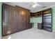 Bedroom with a built in storage unit with a desk and shelving at 600 Park Valley Cir, Minneola, FL 34715