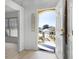 Bright entryway with laminate floors and a view of the charming front yard at 600 Park Valley Cir, Minneola, FL 34715
