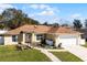 Charming home features a decorative bridge walkway at 600 Park Valley Cir, Minneola, FL 34715