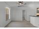 The living room features laminate floors, large windows, and ample natural light at 600 Park Valley Cir, Minneola, FL 34715