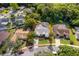 Charming home with mature landscaping, long driveway, and screened-in pool, nestled among lush trees at 1008 Turtle Creek Dr, Oviedo, FL 32765