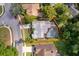 Home with screened-in pool, lush greenery, and mature trees surrounded by a well-kept lawn at 1008 Turtle Creek Dr, Oviedo, FL 32765