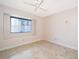 Cozy bedroom with tile flooring, a ceiling fan, and a window for plenty of natural light at 1008 Turtle Creek Dr, Oviedo, FL 32765