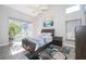 Cozy bedroom with a large window view and natural lighting and a ceiling fan at 1008 Turtle Creek Dr, Oviedo, FL 32765