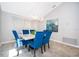 Bright dining room with modern lighting, furniture, and neutral paint at 1008 Turtle Creek Dr, Oviedo, FL 32765