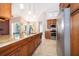 Spacious kitchen features a large island with seating, stainless steel appliances, and ample counter space at 1008 Turtle Creek Dr, Oviedo, FL 32765