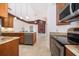 Kitchen boasts granite counters, stainless steel appliances, and a seamless flow into the dining area at 1008 Turtle Creek Dr, Oviedo, FL 32765