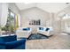 Bright living room with neutral paint, tile floors, and a sliding glass door to the pool at 1008 Turtle Creek Dr, Oviedo, FL 32765