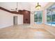 Open-concept living space with sliding doors to the pool area, providing ample natural light at 1008 Turtle Creek Dr, Oviedo, FL 32765