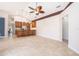 Large living area offers seamless flow to the kitchen with breakfast bar and neutral decor at 1008 Turtle Creek Dr, Oviedo, FL 32765