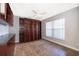 Comfortable office space with custom shelving, a ceiling fan, and a window for natural light at 1008 Turtle Creek Dr, Oviedo, FL 32765