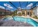 Relaxing screened-in pool area with a spa and plenty of space for outdoor seating at 1008 Turtle Creek Dr, Oviedo, FL 32765