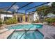 Relaxing screened-in pool area with a spa and plenty of space for outdoor seating at 1008 Turtle Creek Dr, Oviedo, FL 32765