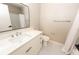 Bathroom with white vanity, modern fixtures, and shower at 10142 Richardson Ct, Orlando, FL 32825