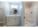 This bathroom features a walk-in shower, modern vanity and black and white mosaic tile floors at 10142 Richardson Ct, Orlando, FL 32825