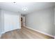 Light-filled bedroom with wood floors, white closet doors, and neutral walls at 10142 Richardson Ct, Orlando, FL 32825