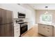 Bright, modern kitchen featuring stainless appliances and an open concept design at 10142 Richardson Ct, Orlando, FL 32825