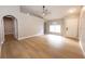 Inviting living room with stylish hardwood floors, neutral walls, and ample natural light at 10142 Richardson Ct, Orlando, FL 32825