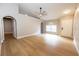 Bright living room featuring sleek wood floors, neutral paint, and an open floor plan at 10142 Richardson Ct, Orlando, FL 32825