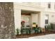 Welcoming entrance with a comfy chair, potted plants, and a glass door at 1020 Siena Park W Blvd # 103, Celebration, FL 34747