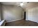 Spacious bedroom with vaulted ceiling, ceiling fan, and wood-look flooring at 10446 Stone Glen Dr, Orlando, FL 32825