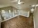 Loft area featuring wood-look floors, a ceiling fan, and railing at 10446 Stone Glen Dr, Orlando, FL 32825