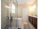 Bathroom with a double sink, a bathtub, and a glass-door shower at 1139 Sand Creek Loop, Ocoee, FL 34761