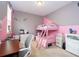 bedroom with bunk beds, a desk, and colorful decor at 1139 Sand Creek Loop, Ocoee, FL 34761