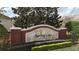 Prominent sign for Spring Lake Reserve surrounded by lush greenery, enhancing the neighborhood's curb appeal at 1139 Sand Creek Loop, Ocoee, FL 34761