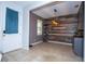 Modern dining room with a unique wood accent wall, decorative shelving, and stylish lighting at 1139 Sand Creek Loop, Ocoee, FL 34761