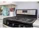 Modern kitchen with stainless steel gas range, white subway tile backsplash, and sleek countertops at 1139 Sand Creek Loop, Ocoee, FL 34761