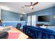 Upstairs loft area featuring blue walls, modern furnishings, and media center at 1139 Sand Creek Loop, Ocoee, FL 34761