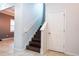 Staircase with wood treads and white risers leads to the second floor of the home at 1139 Sand Creek Loop, Ocoee, FL 34761