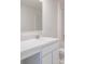 Well-lit bathroom with white cabinets, a sleek mirror, and chrome fixtures, offering a spa-like experience at 1304 Congo Dr, Kissimmee, FL 34759