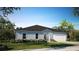 Charming single-story home featuring a well-manicured lawn and a two-car garage at 1304 Congo Dr, Kissimmee, FL 34759