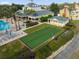 Aerial shot of a bocce ball court, pool and clubhouse at Grande Lakes at 1338 Seven Eagles Ct # 302, Reunion, FL 34747