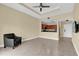 Living room with wood-style tile floors and lots of natural light at 1338 Seven Eagles Ct # 302, Reunion, FL 34747