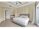 Main bedroom features tile floors and a door to the balcony at 1338 Seven Eagles Ct # 302, Reunion, FL 34747