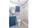 Charming bathroom with blue vanity, white shower and modern fixtures at 1361 Hobson St, Longwood, FL 32750