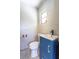 Half bath featuring a modern blue vanity with white top and a comfort height toilet at 1361 Hobson St, Longwood, FL 32750