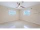 Light-filled bedroom with a modern fan and two windows at 1361 Hobson St, Longwood, FL 32750