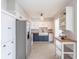 Bright kitchen featuring white and blue cabinetry, stainless steel appliances, and a farmhouse sink at 1361 Hobson St, Longwood, FL 32750