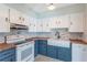 Beautifully updated kitchen with white cabinets, farmhouse sink, butcher block counters, and stylish backsplash at 1361 Hobson St, Longwood, FL 32750